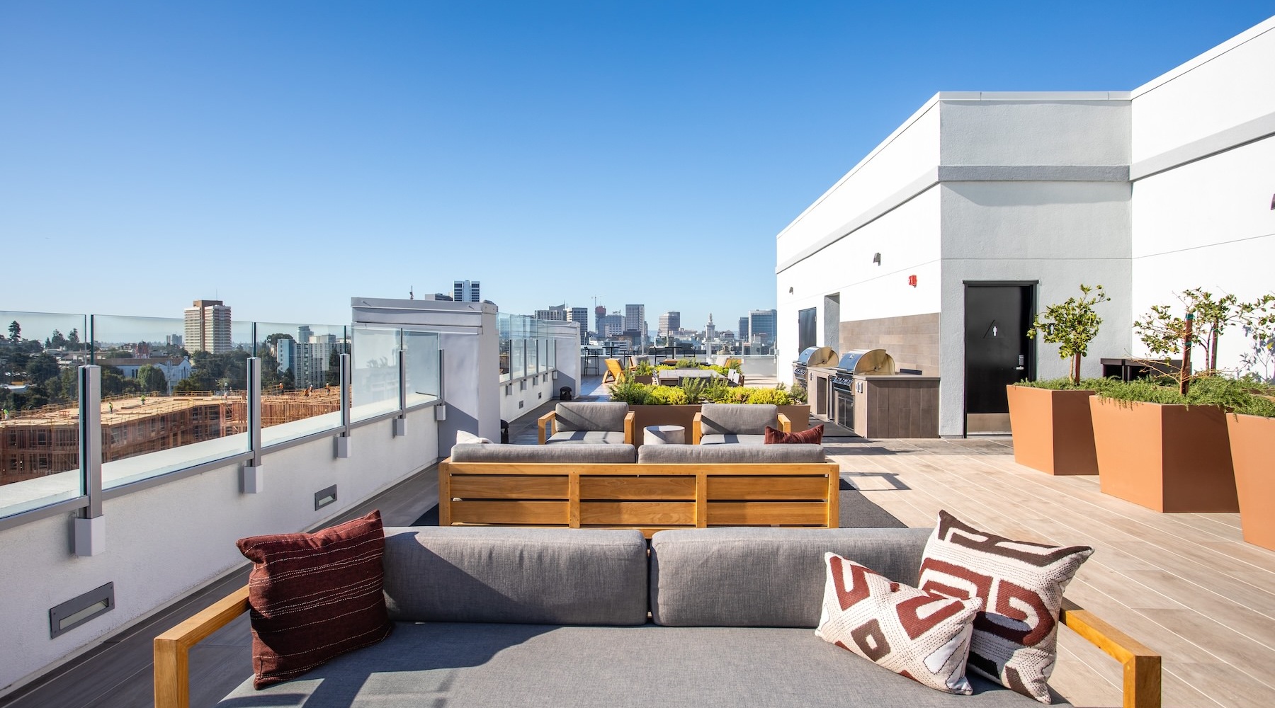 an outdoor lounge space on rooftop