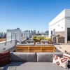 an outdoor lounge space on rooftop