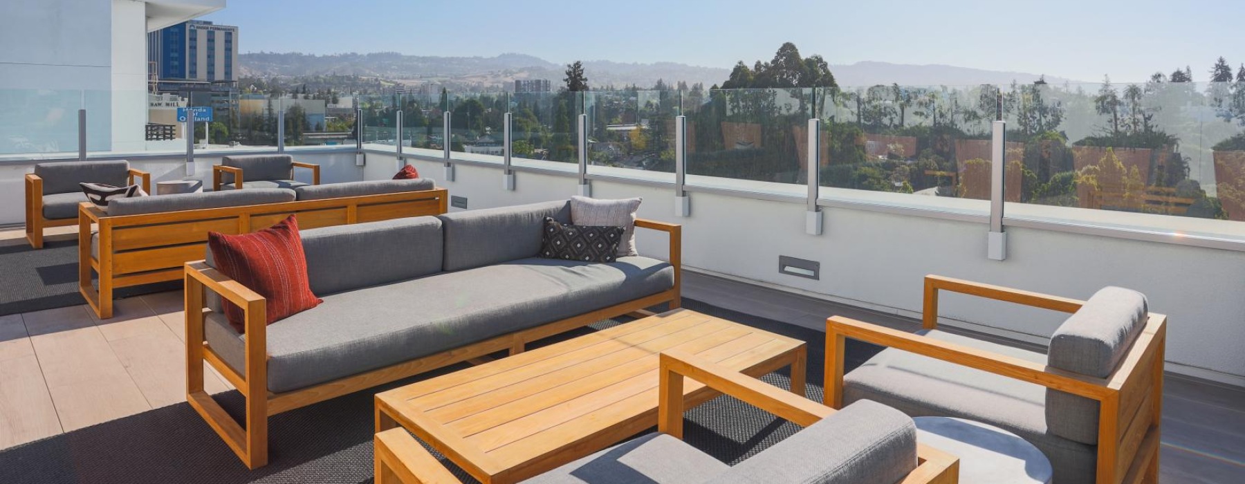 a deck with a view of a city and the ocean