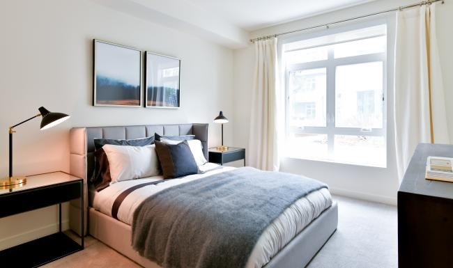 a bedroom with a large window