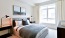 a bedroom with a large window