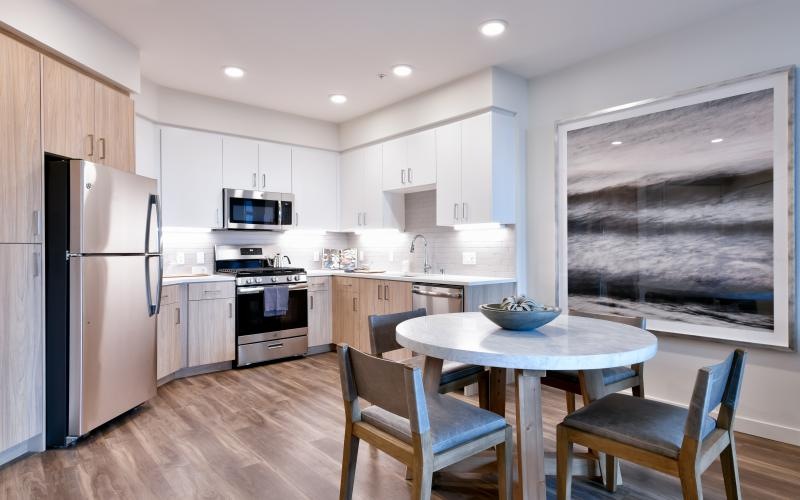 a kitchen with a table and chairs