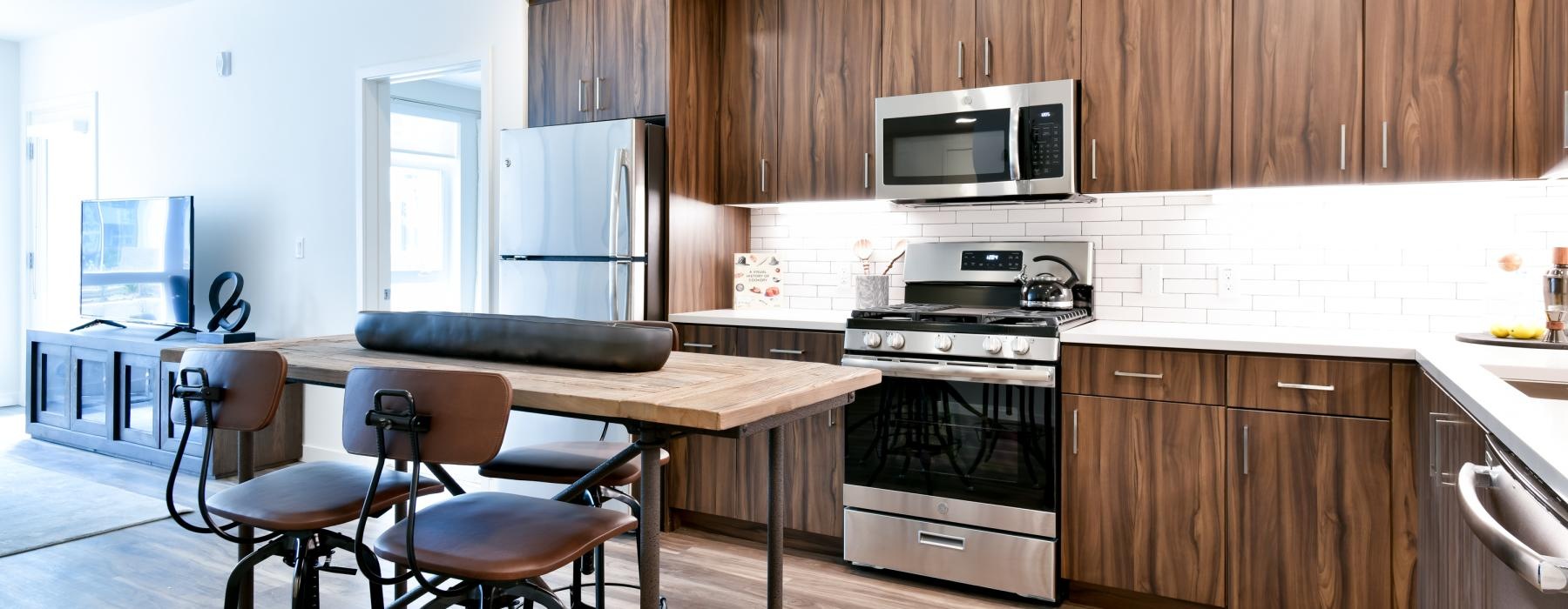 a kitchen with wooden cabinets