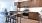 a kitchen with wooden cabinets