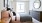 a bedroom with a bed and a mirror
