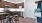 a kitchen with a bar stool and a table